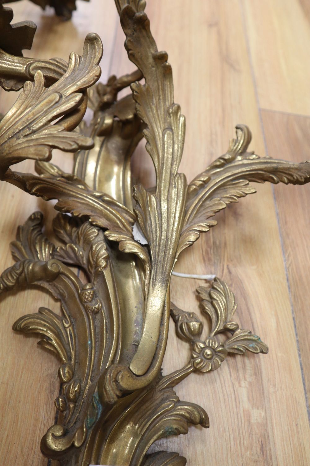 A pair of ormolu scrolled leaf wall sconces, height 54cm